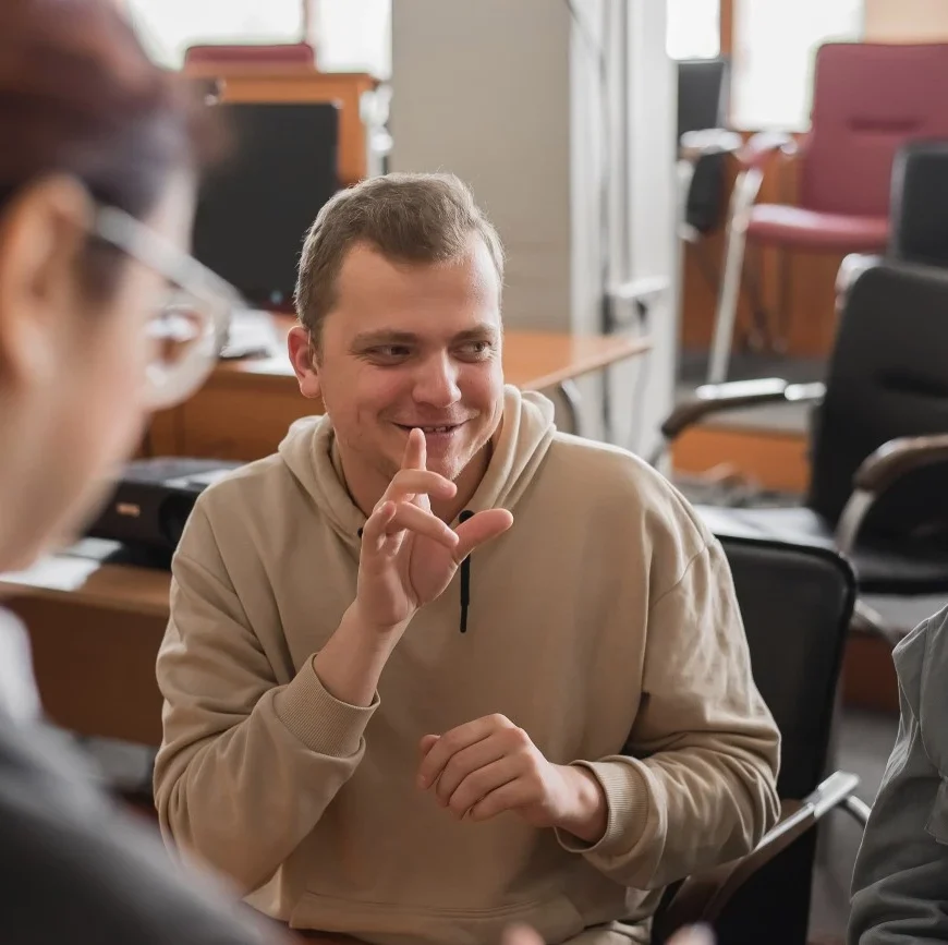 Disabled boy chatting with friends