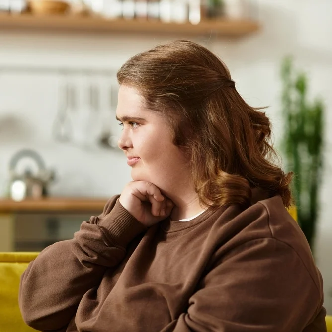 Side pose of disabled women with down syndrome disability