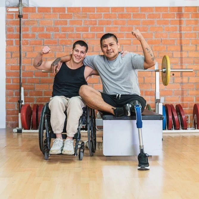 father with a disabled son exercising in gym
